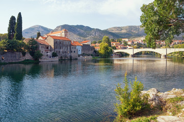 Ancient town on the river bank. Bosnia and Herzegovina, Republika Srpska. Trebisnjica river and Old Town of Trebinje, autumn