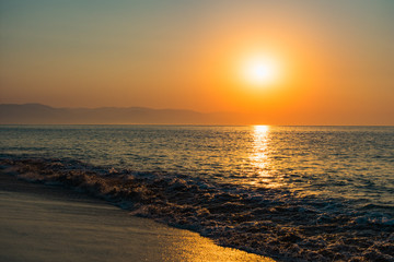 Beach at sunset with shoreline
