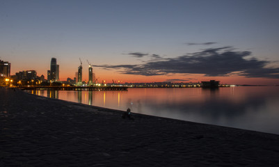 Obraz premium Silhouette construction workers fabricating steel reinforcement bar at the construction site Baku Azerbaijan