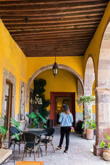 Woman walking in Mexican hacienda