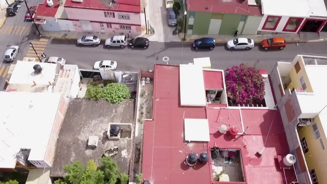 Aerial shot panning up over Oaxaca City in Oaxaca, Mexico on a sunny day.
