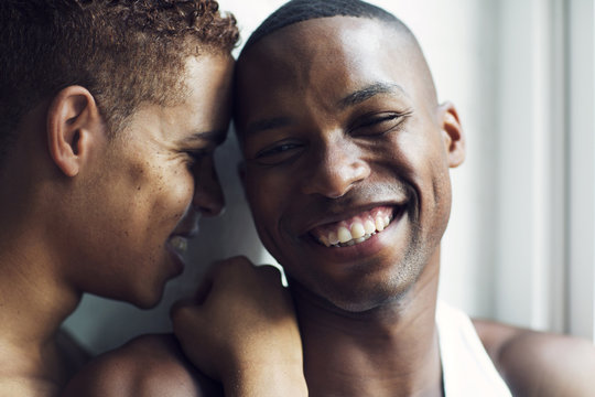 Portrait of laughing couple embracing