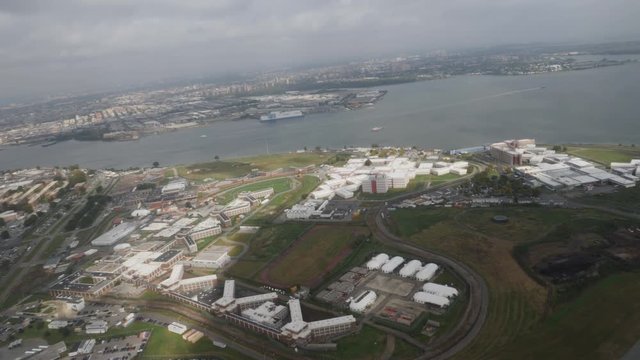 An aerial view of Rikers Island Detention Facility from a plane taking off at LaGuardia Airport.  	