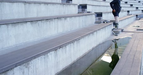 Disabled athletic sanding at sports venue 4k - Powered by Adobe