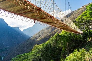 Wood bridge over forest valley in Hidalgo Mexico
