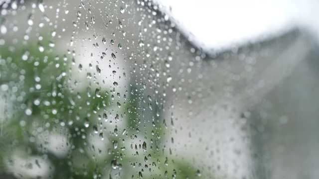 water rain drops on glass window, rainy day weather