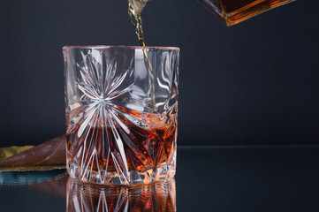 Bottle of whiskey, cognac, bourbon on a black background