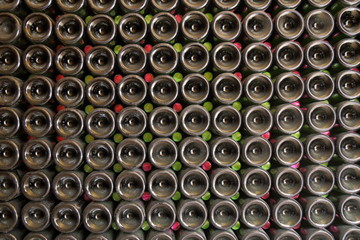 Wine bottles in cellar as abstract background