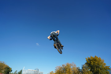 Biker doing stunt in the sky