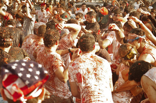 People enjoying La Tomatina festival in Spain