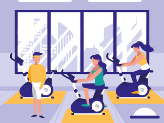 people riding spinning bicycle in sport gym