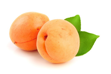 Apricot fruit with leaves isolated on white background macro