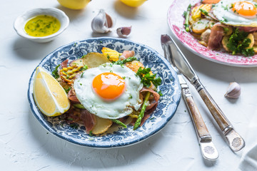 Huevos rotos, eggs, potatoes and serrano ham.