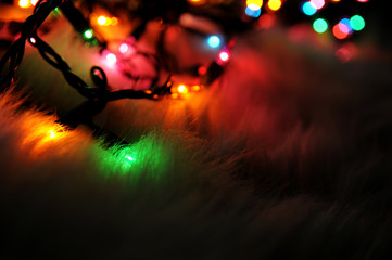 Christmas Lights in the Dark on Fluffy Background