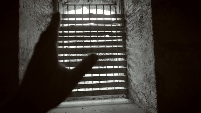 Prison cell doors closing.
Black and white footage.