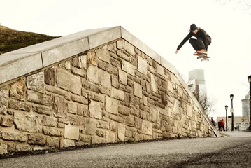 Fotobehang Skateboard Man performing stunt on skateboard  © Cavan for Adobe