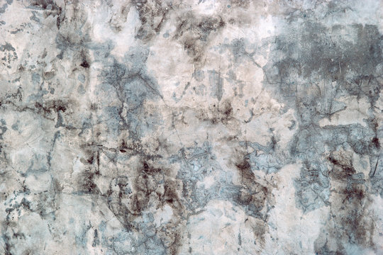 Dark faded concrete texture, molded old wall. close up