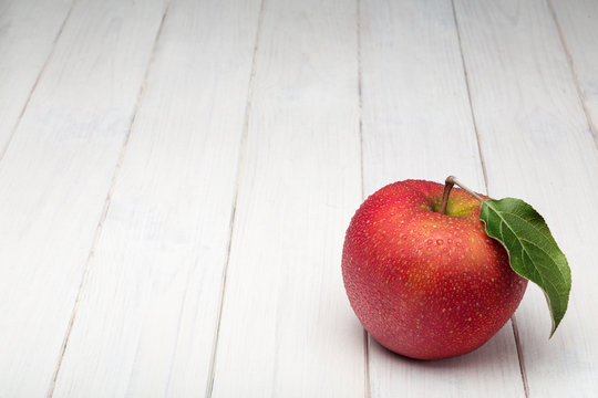 Red aple on white background.
