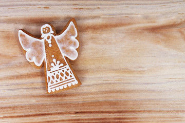 Decorated gingerbread on wooden background