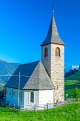 Fototapeta na wymiar Small church in alpine village