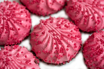 Homemade pink zephyr or marshmallow in pink plate on white background with copy space. Valentine's or Mothers Day concept