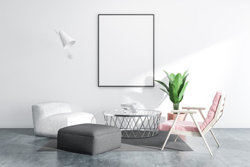 White living room with armchairs and poster