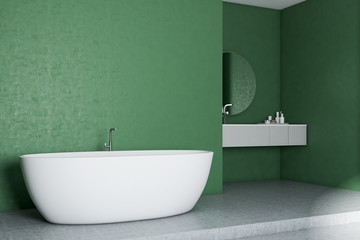 Obraz na płótnie Canvas Green bathroom corner, white tub and sink