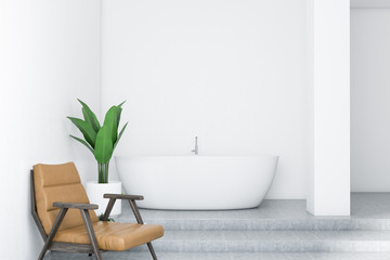 White bathroom interior, white tub and armchair
