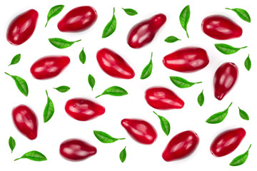 Red berries of cornel or dogwood decorated with leaves isolated on white background. Top view. Flat lay