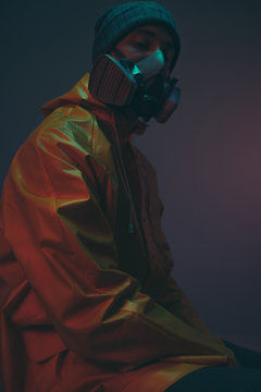 Dark portrait of young male with protection mask/graffiti writer