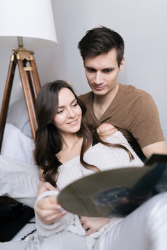 Happy young couple exporing music disks