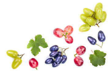 green pink and blue grapes with leaves isolated on the white background with copy space for your text. Top view. Flat lay pattern