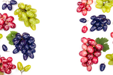 green pink and blue grapes with leaves isolated on the white background with copy space for your text. Top view. Flat lay pattern