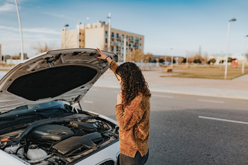 A woman with car problems