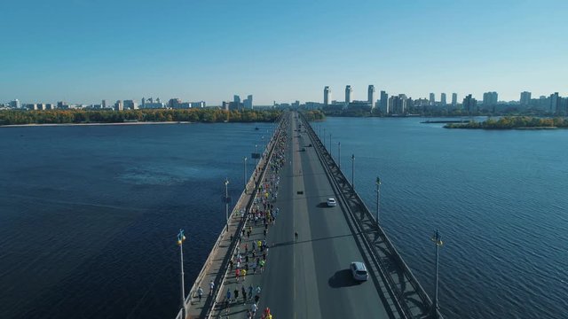 Aerial Drone Fooage. Marathon Running On The Bridge.