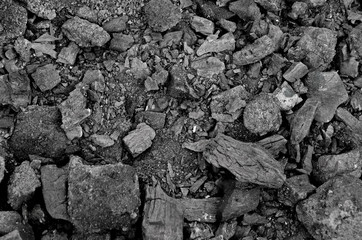 Texture of burnt coal in a fire. gray-black background