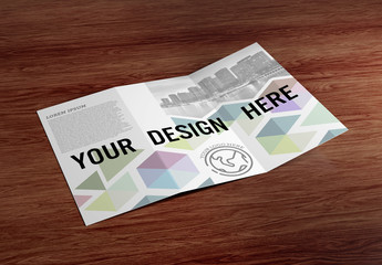 Trifold Brochure on Wooden Table Mockup