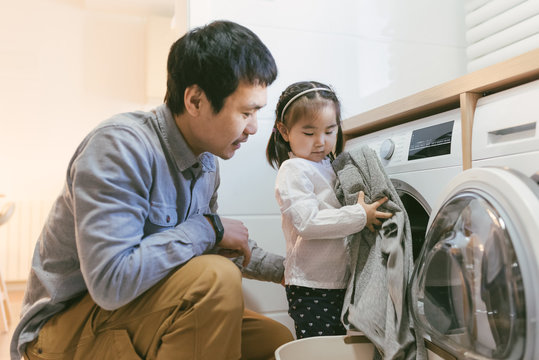 Asian family dong laundry at home