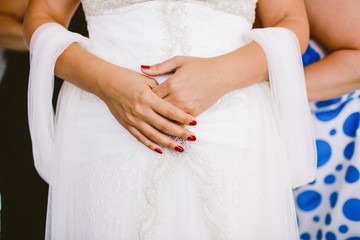 Fototapeta na wymiar Detail of a white and elegant wedding dress.