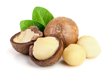 Shelled and unshelled macadamia nuts with leaves isolated on white background - obrazy, fototapety, plakaty