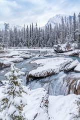 Mountain River Cascading Over Rocks in Winter