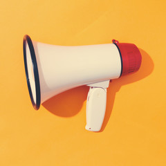 A big megaphone on a orange background