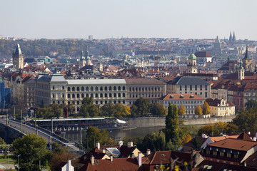 Obraz premium Autumn Prague City with with its Buildings, Towers, Cathedrals and Bridges in the sunny Day, Czech Republic