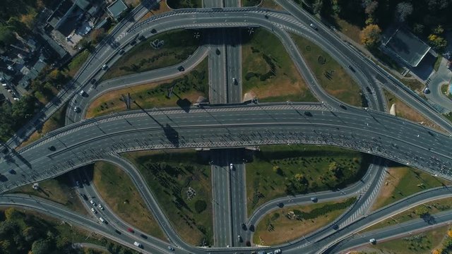 Aerial drone footage. Top view marathon running on the road junction, wide shot