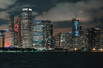 Fototapeta na wymiar Downtown Chicago cityscape skyline at night with Lake Michigan in the foreground