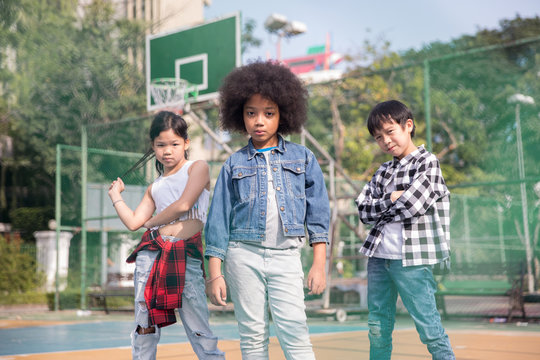 Portrait of three cool kids looking at camera