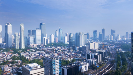 Naklejka na ściany i meble Beautiful Jakarta cityscape under blue sky