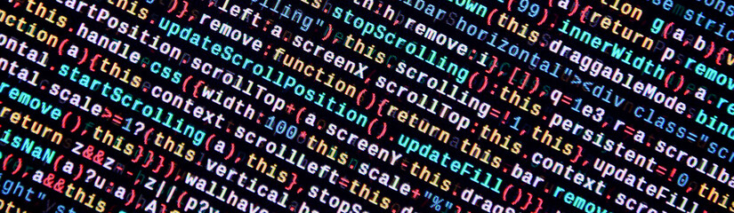 Writing programming code on laptop. Digital binary data on computer screen