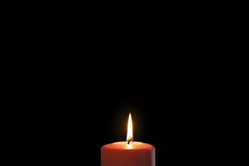 Christmas red candle in dark background