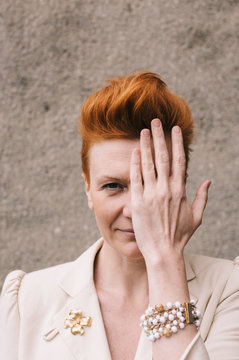 attractive woman of fifty years with red hair